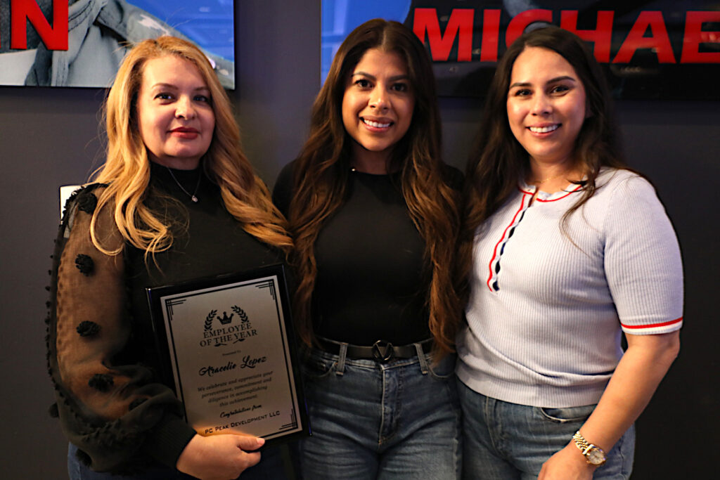 Women with real estate careers as consultants with an employee of the year award